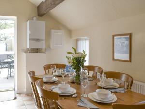 a dining room with a table and chairs and a table and chairsktop at One Uk33732 in Cartworth