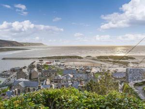 an aerial view of a town next to the ocean at Bwth Carron in Barmouth