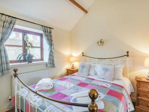 a bedroom with a bed and a window at The Tack Rooms - Uk37520 in Routh