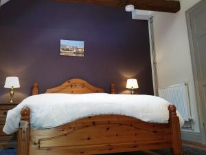 Säng eller sängar i ett rum på Stables Cottage