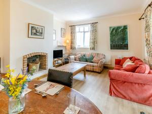 a living room with a couch and a table at Summer House in Sutton on Sea