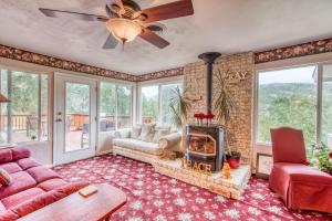 a living room with a couch and a fireplace at A Bed of Roses in Oakhurst