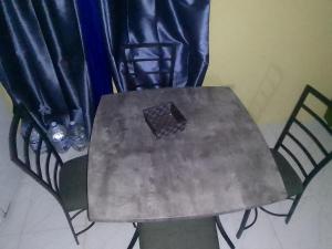 a table with a box on top of it at Simpson's residence in Lucea