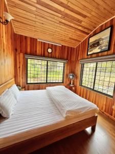 Postel nebo postele na pokoji v ubytování Nhà An Cozy