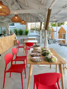 a table and chairs with plates of food on it at Serene Khaokho in Ban Khao Ya Nua