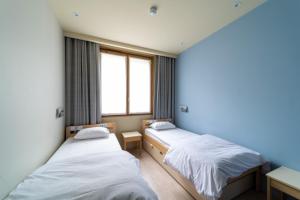 Cama o camas de una habitación en Adveniat Paris