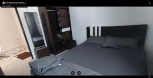 Katil atau katil-katil dalam bilik di Uncle Didi Guest House Pasir Gudang