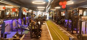 a gym with a bunch of tread machines in it at HOTEL SILKHOUSE PREMIER in Dānāpur