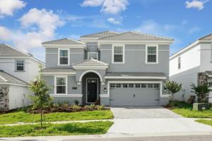 a gray house with a garage at Champions Gate Resort, Game Room, Theater, Miles From Disney! in Davenport