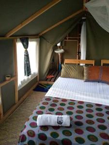 a bedroom with a bed in a tent at Mwanza lake view FARM Eco LODGE in Sengerema