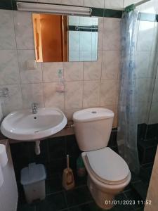 a bathroom with a toilet and a sink at ΡΑΧΗ in Kerasea