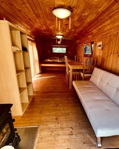 a living room with a couch and a table at Agriturismo Pereti in Roccatederighi