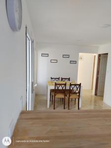 a dining room with a table and two chairs at Los nogales in Tandil