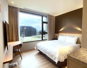 Postel nebo postele na pokoji v ubytování alfar Hotel