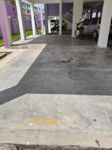 an empty parking lot in a building at Dhuha Homestay @ Seri Alam Masai , Johor in Masai