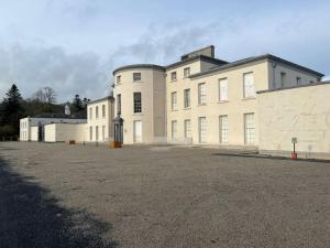 a large white building with a lot of windows at Glencree Air in Kilmeaden