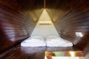 Postel nebo postele na pokoji v ubytování Durian Ecolodge