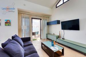 TV a/nebo společenská místnost v ubytování Vivienda Vacacional El Golfo