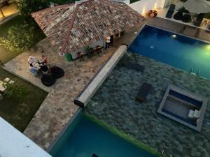 an overhead view of a swimming pool in a house at Handagedara Resort & Spa in Mirissa