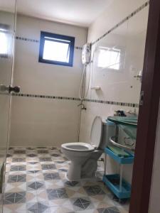 a bathroom with a toilet and a sink at Min&Me House Pattaya in Nong Prue