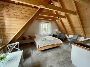 a bedroom with a bed in a attic at SEENLANDHOF in Senftenberg