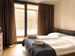 Postel nebo postele na pokoji v ubytování Kora Apartments