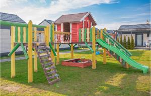 a playground with a slide and a ladder at Awesome Home In Jezierzany With Kitchen in Jezierzany