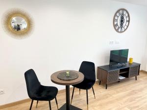 Televízia a/alebo spoločenská miestnosť v ubytovaní L Evasion - Appartement Plage - TV HD - WIFI FIBRE