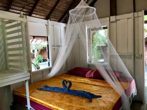 Postel nebo postele na pokoji v ubytování Rasta Baby Bar & Bungalows - Suitable for young travelers