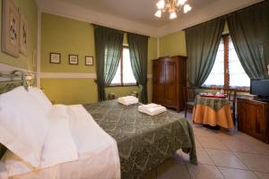 Posteľ alebo postele v izbe v ubytovaní B&B Old Florence Inn