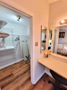 a room with a desk and a mirror at Awesome Home in suburb Washington DC near Airport with WiFi and Parking in Herndon