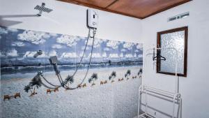 a room with a painting on the wall at Sun Set Sea Family House in Weligama +55 photos