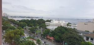 an aerial view of a city with a river and buildings at Tripleview luxurious eton baypark manila in Manila