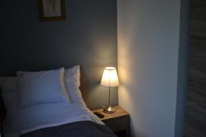 Posteľ alebo postele v izbe v ubytovaní Főnix Design Rooms