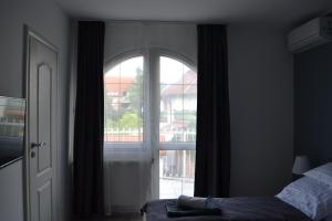 Posteľ alebo postele v izbe v ubytovaní Főnix Design Rooms
