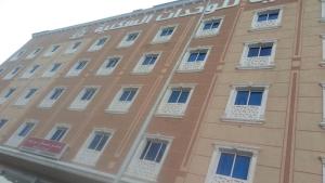a facade of a building with white windows at شقق مساكن الراية المخدومه in Al Khobar