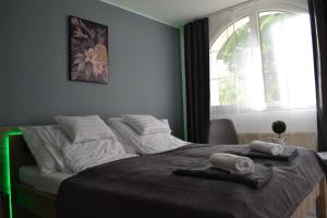 Posteľ alebo postele v izbe v ubytovaní Főnix Design Rooms