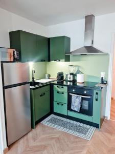 Dapur atau dapur kecil di Les Marmottons appartement cosy