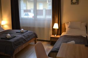 Posteľ alebo postele v izbe v ubytovaní Főnix Design Rooms