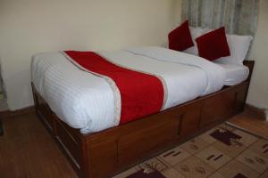 Postel nebo postele na pokoji v ubytování Hotel Snow Leopard