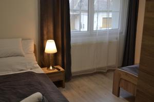 Posteľ alebo postele v izbe v ubytovaní Főnix Design Rooms