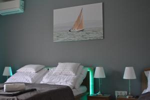 Posteľ alebo postele v izbe v ubytovaní Főnix Design Rooms