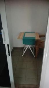 a small room with a table and a chair at joli studio meuble 25 euro par nuit. in Lomé