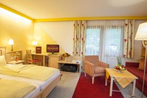 Łóżko lub łóżka w pokoju w obiekcie Hotel-Restaurant Burgblick