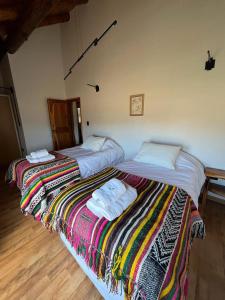 Una cama o camas en una habitación de Frontera Andina