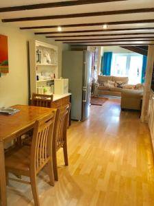 a kitchen and dining room with a table and chairs at Ivy House Barn, Heckington in Heckington