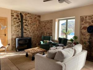 a living room with a couch and a fireplace at La Morera in Alcaraz