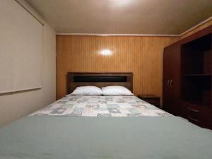 Postel nebo postele na pokoji v ubytování Cabaña en Puerto Montt