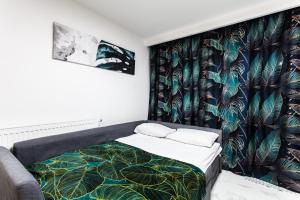 Posteľ alebo postele v izbe v ubytovaní Zielony Apartament Gliwice