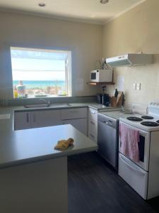 Kuchyň nebo kuchyňský kout v ubytování Coastal Accommodation + 1 fotografie